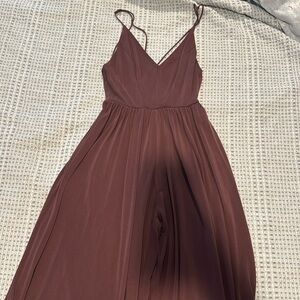Romper open strapppy back. 
In a plum color
From urban outfitters